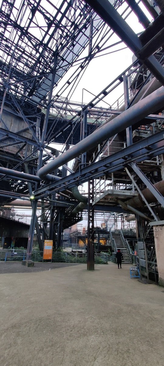 a large metal structure with lots of pipes